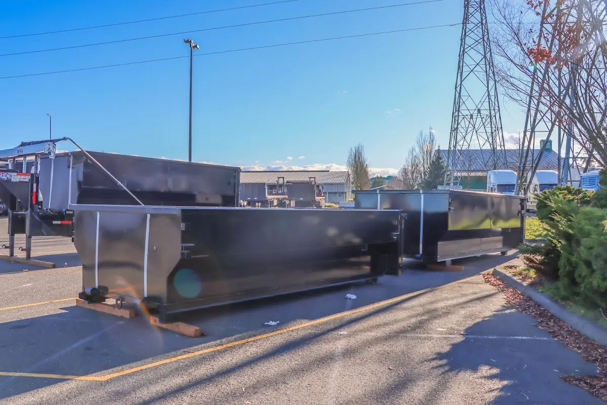 Roll-off dumpster ready for waste disposal at job site for 2 Yard Dumpster Rental in Turner